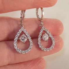 Theses Beautiful Round Stone In A Water Drop Hoop Earrings Are Made Of 18k White Gold Filled With (Lab Created) White Topaz Zircon Stones. Brand New, Never Been Worn. Lead And Nickel Free. These Fine Quality Earrings Are Perfect For Everyday Wear Or A Special Gift. Get An $18 Gift Of Your Choice In My Listings With Purchase Of Two Or More Items. Please Send Offers And Questions. Earrings: 13 X33mm Or .51” X 1.30" Stone: 5mm Or .20" Hoop Dia: 11mm Or .43" Huggie Hoop Clip (Pierced)