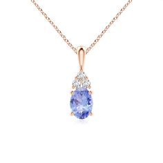 Set in 18k rose gold, this classic solitaire tanzanite pendant is the perfect blend of style and sophistication. It features a radiant bluish-violet tanzanite adorned with three sparkling round diamonds on the top. Linked to a lustrous v-bale, this four-prong set tanzanite pendant effortlessly captures attention. Tanzanite Pendant, Solitaire Pendant, 18k Rose Gold, Prong Setting, Round Diamonds, Violet, 18k Gold, Diamonds, Yellow Gold