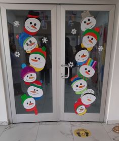 two frosted glass doors with snowmen on them