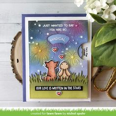 a card with two dogs and fireworks on it