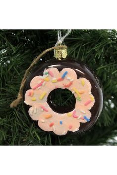 a doughnut ornament hanging from a christmas tree