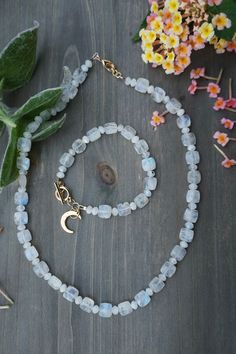 This style  and cut of moonstones is a rare find. There are only a few of this faceted, flat square moonstone beads,. These are AAAA quality moonstone beads with an unusual style which makes this necklace and bracelet set so pretty.  Necklace is 18 inches long with 2 inch extender Bracelet is 7 inch toggle clasp with moon charm Stunning! Bromley Squared Designs searches jewelry shows to find unique gemstones, pearls and fine to trendy jewelry findings. Custom designs are our specialty, let us talk and make a plan. We spend a lot of time search and find great pieces as we say. Our goal is to design beautiful pieces for everyday wear to special occasions. We design with several thoughts in mind. Jewelry should set the stage, the gemstones should shine enough to complete the outfit. Thoughts Moonstone Jewelry With Natural Round Beads, Moonstone Gemstone Beads Jewelry For Healing, Moonstone Jewelry With Round Natural Stones, Spiritual Moonstone Jewelry With Gemstone Beads, Moonstone Bracelet With Moon Charm As Gift, Spiritual Moonstone Jewelry With Faceted Beads, Bohemian Moonstone Jewelry With Faceted Beads, Adjustable Moonstone Jewelry With Moon Charm, Celestial Moonstone Jewelry With Natural Stones