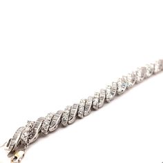 Stunning vintage round and baguette diamond bracelet, platinum. Beautiful vintage high jewelry. Approximately 17.40 carats of round brilliant and baguette cut diamonds. Approximately G/H color and VS-SI clarity. Platinum, 44.01 grams, 7in. Accommodated with an up-to-date digital appraisal by a GIA G.G. once purchased, upon request. Please contact us with any questions. Diamond White Platinum Bracelet With Baguette Diamonds, Platinum Diamond Bracelet With Baguette Diamonds In Diamond White, Classic Silver Baguette Diamond Bracelet, Anniversary Diamond Bracelet With Baguette Diamonds, Formal Silver Baguette Diamond Bracelet, Formal Diamond Baguette Bracelet, Fine Jewelry Round Diamond Bracelet With Baguette Diamonds, Silver Round Diamond Bracelet With Baguette Diamonds, Fine Jewelry Diamond Bracelet With Baguette Diamonds