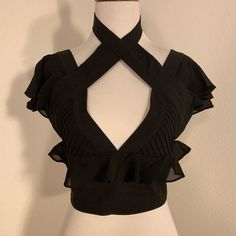 Nwot Nasty Gal Black Cropped Blouse Top Size: X-Small Material Content: 97% Polyester 3% Spandex *Nwot *Flutter Layered Sleeve *Deep V-Neck With Pleated Sides *Ruffle Around Bust Line *Criss Cross At Chest With Chocker At Neck *Full Back Zipper (Exposed) In New Without Tag Condition And In Original Packaging. Thanks So Much For Looking! Elegant Short Sleeve Crop Top For Party, Elegant Short Sleeve Party Crop Top, Edgy Short Sleeve Crop Top For Party, Cropped Ruffle Tops For Party, Elegant Ruffled Crop Top Blouse, Cropped Ruffled Party Tops, Cropped Fitted Blouse For Party, Fitted Cropped Party Blouse, Chic Short Sleeve Crop Top For Date Night