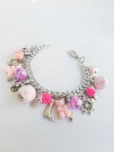 charm bracelets, pendant bracelet, buddah charm, pink rose, silver charm, charm chain bracelet, silver charm, vintage jewelry, charm braclet You will receive a similar bracelet to the one in the pictures :) The bracelet goes from 6.50 to 8.50 inches and is adjustable with a clasp. TAKE ADVANTAGE OF COMBINED SHIPPING Only 0.50€ (about 0.60 USD) for adicional item!! Handmade with love :) Pink Metal Charm Bracelet With Charms, Pink Metal Bracelet With Charms, Pink Metal Bracelets With Charms, Pink Metal Charm Bracelet, Handmade Pink Metal Bracelets, Handmade Pink Metal Bracelet, Adjustable Pink Metal Charms, Nickel Free Pink Charm Bracelet, Pink Metal Jewelry With Vintage Charm