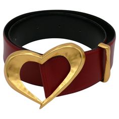 CHRISTIAN LACROIX vintage red grained leather belt featuring an oversized gold toned heart buckle. Marked CHRISTIAN LACROIX Paris. Made in France. Indicated size : 75/30. Indicative measurements : adjustable length from approx. 71 cm (27.95 inches) to approx. 79 cm (31.10 inches) / one extra hole was made to suit a larger waist of approx. 84 cm (33.07 inches) / strap width approx. 4.7 cm (1.85 inches) / buckle approx. max. 10.4 cm x max. 6.5 cm (max. 4.09 inches x max. 2.56 inches). Materials : Dior Boutique, Abstract Necklace, Suede Belt, Vintage Suede, Vintage Glasses, Christian Lacroix, Vintage Jewels, Metal Buckles, Vintage Brooches