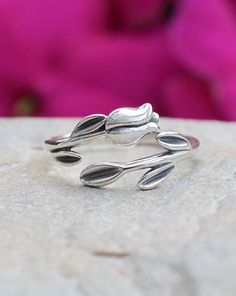 Sterling Silver Tulip with Leaves Wrap Ring | The Life Divine Flower detail measures approximately 1/2" H x 1 1/2" W Adjustable Sterling Silver Ring For Spring, Sterling Silver Open Ring For Spring, Adjustable Flower Ring For Spring Anniversary, Spring Flower Promise Ring, Spring Anniversary Adjustable Flower Ring, Adjustable Flower Promise Ring For Spring, Spring Promise Ring With Open Ring Shape, Spring Promise Ring With Open Design, Spring Open Ring For Promise