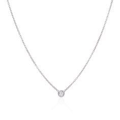 Our 14K White Gold Bezel-Set Round Diamond Solitaire Necklace is a beautiful piece for everyday wear and comes in six different diamond sizes. Available diamond sizes: .07 carats .10 carats .15 carats .20 carats .25 carats .30 carats Necklace length is approximately 18" and is adjustable Estimated Delivery: 1-2 weeks Timeless White Gold Diamond Necklace With Single Diamond, Minimalist White Gold Diamond Solitaire Necklace, Timeless Everyday Diamond Necklace With Diamond Accents, Timeless Diamond Necklace With Diamond Accents For Everyday, Timeless Everyday Diamond Necklace With Accents, Minimalist Diamond Solitaire Necklace With Brilliant Cut, Diamond White Cubic Zirconia Necklace With Single Cut Diamonds, Minimalist Brilliant Cut Diamond Solitaire Necklace, Minimalist White Gold Diamond Necklace With Lab Grown Diamonds