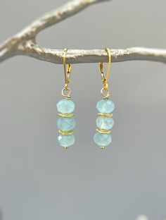 "Dainty handmade genuine aquamarine dangle earrings.  Lightweight earrings for women. Sparkling aquamarine blue gemstone rondelles hang from your choice of Sterling Silver, 14k gold Fill, or Rose Gold Fill French hook ear wires or leverbacks. Gemstone drops are dainty approx 1/4\" wide. Simple, elegant everyday earrings. These would make a lovely gift for mom or wife with a March birthday also something blue bridal earrings or bridesmaids gifts. Aquamarine size: approx 1/4\" wide Overall Earring Handmade Light Blue Aquamarine Jewelry, Aquamarine Gemstone Dangle Jewelry, Handmade Aquamarine Dangle Earrings, Handmade Aquamarine Drop Earrings, Handmade Gold Aquamarine Earrings, Handmade Blue Topaz Dangle Earrings, Aquamarine Gemstone Drop Earrings, Aquamarine Drop Earrings, Blue Bridal Earrings