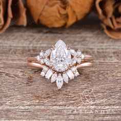 a rose cut diamond engagement ring set on top of a wooden table