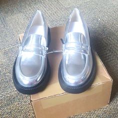 Flat Loafers Metallic Effect. High Vamp With Saddle Round Toe. Sole 1 2 Inches. 100 Polyurethane. Silver Round Toe Loafers For Work, Silver Round Toe Loafers For Spring, Zara Classic Flats With Round Toe, Classic Zara Flats For Spring, Silver Slip-on Loafers For Spring, Trendy Zara Loafers With Round Toe, Trendy Zara Loafers For Office, Casual Silver Loafers For Spring, Trendy Silver Loafers With Round Toe