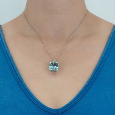 This stunning pendant is accented with one (1) cut-cornered rectangular mixed cut natural aquamarine set into a four-prong setting and nine (9), bead/prong set, old European cut diamonds. The pendant measures 26.4mm X 14.0mm X 10.1mm. The chain in the picture is not included. One of the diamond accent is unnoticeably chipped. The chain in the photo is not included. Elegant Aquamarine Necklace For Formal Occasions, Luxury Aquamarine Necklace For Formal Occasions, Formal White Gold Aquamarine Necklace, Fine Jewelry: Diamond Cut Rectangular Pendant, Fine Jewelry Rectangular Pendant With Diamond Cut, Fine Jewelry With Diamond Cut Rectangular Pendant, Fine Jewelry With Rectangular Diamond Cut Pendant, Luxury Aquamarine Pendant Necklace, Modern Diamond Square Pendant Jewelry