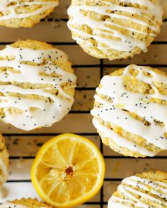 lemon poppy seed cookies with white icing and sprinkles on a cooling rack