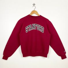 Vintage NCAA Stanford University Cardinal Crewneck Sweatshirt Print Logo Red Color Men's S - Made in Honduras  - Materials : Cotton, Polyester  - Tag Reads : S Kindly see the actual measurements (All measurements were taken lying flat) - Actual size manual measurements * Width (Armpit to armpit) : 20 inches * Length (Shoulder to end of garment) : 24 inches * Sleeve length : 24 inches - Condition : * Good condition 9/10 (90%) * Free from any tear and major defect - Shipping : * DHL EXPRESS = 3-6 business day arrived * Please PROVIDE your PHONE/CONTACT NUMBER for SHIPPING/DELIVERY purpose DON'T FORGET TO VISIT MY SHOP FOR MORE GREAT STUFF, THANK YOU. Red Varsity Top With Ribbed Cuffs, Vintage Red Crew Neck Tops, University Red Crew Neck Top For Streetwear, Red Collegiate Cotton Sweater, Sporty University Red Crew Neck Sweatshirt, Red College Sweater With Ribbed Cuffs, Vintage Red T-shirt For Winter, Red Crew Neck Top With Ribbed Cuffs, University Red Varsity Crew Neck Sweatshirt