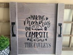 a wooden sign that says making memories one campsite at a time the rawleys