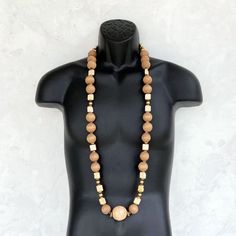 This AMAZING wood bead necklace was handmade using a mix of unique beads - large 25mm round distressed mocha brown wooden beads, an extra large 35mm round distressed beige wood focal bead, square shaped cream ceramic beads, 8mm round gold painted wood beads, small agate gemstone rondelles, and a variety of small wooden beads. This is one of the most special necklaces that I've ever made! It measures a little over 44 inches in length and is securely fastened with a sterling silver toggle clasp. P Special Necklaces, Long Boho Necklace, Long Necklace Boho, Necklace Mens, Special Necklace, Wood Bead Necklace, Wooden Necklace, Wood Necklace, Mocha Brown