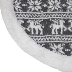 a white and black sweater with elephants on it