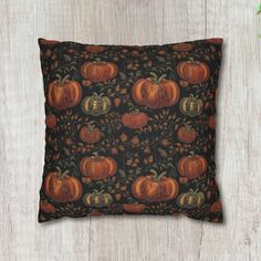 a decorative pillow with pumpkins on it