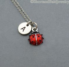 "* Ladybug charm in Silver plated and hand enameled. Approx: 7/16\" * Hand Stamped Initial Charm - Antique Silver Pewter 3/8\" (9mm) * Chain length - 16\", 18\", 20\" * Add a birthstone or Freshwater pearl for $3.50 https://www.etsy.com/listing/110444872 * Additional Hand Stamped Initial Charms $4.50 each: https://www.etsy.com/listing/107021419 * Go back to Short and Bald Jewelry http://www.etsy.com/shop/ShortandBaldJewelry * Your purchase will arrive attractively packaged and ready to give." Lady Beetle, Initial Charm, Initial Necklace, Hand Stamped, Freshwater Pearls, Charm Necklace, Antique Silver, Initials, Monogram