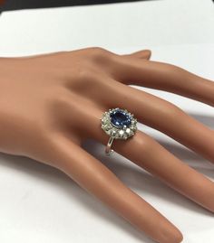 a woman's hand with a ring on it