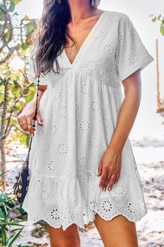 Dreaming of summer vibes? The White Eyelet V-Neck Short Sleeve Mini Dress is your perfect match with its breezy eyelet details and playful V-neckline. Ideal for spontaneous adventures and sunny days when you want to look effortlessly fresh. Product code: CAA05A4H040CC Features:  Woven V-neckline Short sleeves Mini Material: 100%COTTON. V-neck Sundress For Summer Outings, Summer V-neck Mini Dress For Daytime, V-neck Mini Dress For Summer Daytime, Casual V-neck Sundress For Summer Outings, Casual Eyelet Dress For Brunch, Breezy White V-neck Mini Dress, Summer V-neck Eyelet Dress, V-neck Hollow Out Dress For Beach Season, Summer Eyelet Dress With V-neck