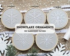 four snowflake ornaments with text overlay that reads, snowflake ornaments pop embroidery pattern