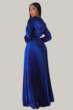 Elevate your elegance with the Eulalia Pleated Maxi Dress. Featuring a deep V-neck, wrap design, and belted high waist, this A-line dress boasts long bishop sleeves and a beautifully pleated hem. Crafted from non-stretch fabric, it offers a sophisticated and timeless look for any special occasion. Shop now to embrace refined style! 95% Polyester, 5% Elastane Model is wearing size small Please allow 3-5 business days to process and ship Formal V-neck Pleated Dress With Pleated Hem, Elegant Pleated Long Sleeve Dress For Party, Formal Pleated Long Sleeve Dress For Fall, Elegant Fitted Belted Pleated Dress, Blue Pleated Maxi Dress For Fall, Pleated Maxi Length Long Sleeve Party Dress, Pleated Long Sleeve Maxi Dress For Party, Party Long Sleeve Pleated Maxi Dress, Party Dress With Pleated Sleeves And Surplice Neckline