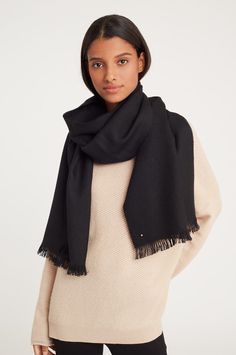 Crafted in Peru from the softest baby alpaca, this beautifully oversized scarf is complete with eyelash fringe at each end along with the subtle detail of our gold button. Latest Winter Fashion, Sculptural Jewelry, Jewelry Scarves, Alpaca Scarf, Bag Essentials, Margaret Howell, Fall Winter Wardrobe, Oversized Scarf, Black Scarf