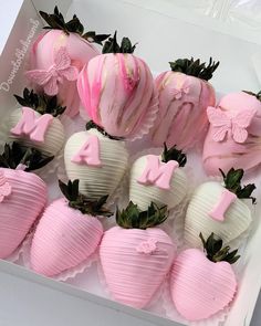 pink and white chocolate covered strawberries in a box with the number one on them