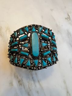 Vintage Navajo style faux turquoise cuff bracelet In excellent condition  Measures 2" at widest Southwestern Style Bangle Cuff Bracelet For Festivals, Southwestern Turquoise Bangle, Western Style Blue Cuff Bangle Bracelet, Vintage Turquoise Cuff Bracelet For Festival, Turquoise Vintage Cuff Bracelet For Festival, Western Turquoise Bangle Cuff Bracelet, Western Style Turquoise Bangle Cuff Bracelet, Navajo Style, Turquoise Bracelet Cuff