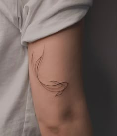 a woman's arm with a tattoo design on the left side of her arm