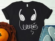 ---- Description: Headphone music shirts, Music T-Shirts, Music life Tees, Gift for music lover shirt, love music shirts, Funny music shirt, cute music tees  HOW TO ORDER  1-) Check and Review all Photos. 2-) Select Your T-Shirt Size and T-Shirt Color from drop down menus. 3-) Select Your Design Print Color from images. 4-) Choose Quantity. 5-) Click ADD TO CART. You can go back and add a different color for your family members, or you can complete the checkout. 6-) Click "Proceed to Check Out" Cheap Music-themed T-shirt With Text Print, Music Shirts Design, Cheap Music-themed Shirt For Fans, Music Tee Shirts, Music Shirt Design, Headphone Music, Cute Music, Music Shirts, Music Beats