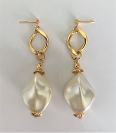 "Large Faux Baroque Pearl Drop Pierced Earrings on Gold Tone Curb Chain with Ribbed Gold Bead Caps Natural Pearl Colored Baroque Faux Pearls Dangle From Gold Tone Curb Chain with Small Ball Tops Earrings Measure 2 1/2\" Long x 3/4\" Wide at Pearl Baroque Pearls are Oblong Shaped Gold Tone Earring Backs Earring Pair Weighs 13 Grams New Vintage From the 1980's COMPLIMENTARY DOMESTIC SHIPPING" Elegant Dangling Bead Pearl Earrings For Party, Gold Pearl Earrings With Dangling Beads For Party, Elegant Dangling Pearl Earrings For Party, Elegant Beaded Pearl Earrings For Festive Occasions, Adjustable Gold Metal Pearl Earrings, Gold Pearl Adjustable Earrings, Party Gold Beaded Pearl Earrings, Elegant Metal Pearl Earrings With Dangling Beads, Adjustable Gold Earrings With Beaded Chain