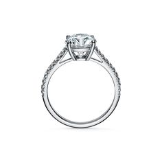 a diamond engagement ring on a white background