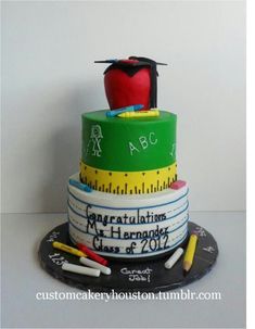 a cake that is decorated to look like a graduation hat and measuring tape with an apple on top