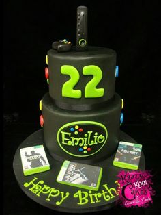 a birthday cake with the number 22 on it and video game memorabilia around the edges