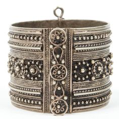 Vintage Moroccan Berber tribal bracelet Moroccan tribal bracelet from the High Atlas of Morocco. Handcrafted by Berber women using Moroccan silver nickel. The ethnic Nomadic and Bedouin jewelry from the Maghreb and North Africa is usually made of silver and the designs are full of symbolism to protect from the evil eye. This bracelet is a stunning piece of Tribal jewelry. Hinged closure. Measures: Inside 2.5" in diameter, outside 3" in diameter. Ethnic Origin: African Features: Ethnic Regional & Festival Silver Beads Bangle Jewelry, Silver Bohemian Cuff Bracelet, Bohemian Sterling Silver Cuff Bracelet, Heavy Silver Bracelet For Festivals, Bohemian Antique Silver Bracelet, Bohemian Oxidized Silver Cuff Bracelet, Bohemian Oxidized Sterling Silver Bracelet, Bohemian Antique Silver Bracelet Jewelry, Bohemian Silver Cuff Bracelet For Festival