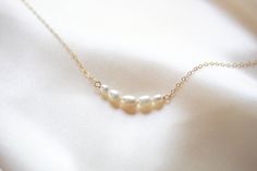 Our new delicate pearl necklace DEMI 😀 #daintynecklace #treasures570 #treasuresbyagnes #bridalnecklace #necklaceforbride #necklaceforthebride #instabride #weddingnecklace #jewelry #instawedding #bridalinspo #bridaljewelry #bridalinspiration #bridetobe2023 #glambride #weddingjewelry #jewelryforbride #bride #bridesmaid #specialoccasion #handcrafted #pearlnecklace #pearljewelry #goldnecklace #simplenecklace Delicate Single Strand Bridal Necklace, Elegant White 16 Inch Pearl Necklace, Elegant 16 Inch Pearl Necklace Gift, Elegant 16-inch Pearl Necklace Gift, Delicate Bridal Necklace With Pearl Chain, Delicate Pearl Lariat Necklace, 14k Gold-filled Pearl Drop Necklace For Wedding, 14k Gold Filled Pearl Drop Necklace For Wedding, 14k Gold-filled Necklace With Pearl Charm For Wedding