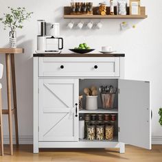 an open cabinet in the corner of a room