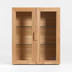 an empty wooden cabinet with glass doors