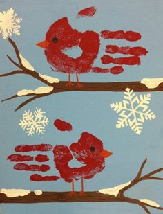 two red birds perched on branches with snowflakes in the background and one bird sitting on top of another branch