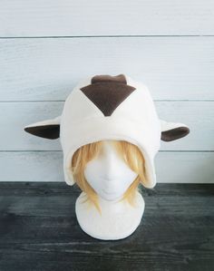 This Bison hat is made from fleece. ⫸ Perfect for: fans, cold weather, costumes, or conventions. Very warm! ⫸ Size: Fits anyone age 5+, one size fits most. Circumference about 24-25 in. ⫸ Care instructions: I recommend hand wash but should be fine in machine wash cold. All hats are made in a smoke-free, pet-free environment. All hats are made with a sewing machine. Patterns and designs are drawn, cut, and made by me. ▎Free shipping on orders over $35 (ground advantage shipping only) ▎ ⫸ Shipping White Themed Costume Hats And Headpieces, Themed White Costume Hats And Headpieces, White Costume Ears For Cosplay, White Adjustable Costume Accessories For Cosplay, Themed Cosplay Hat, One Size Fits Most, Themed Hats For Cosplay, One Size Fits Most, Themed Cosplay Hat, Adjustable Felt Hat For Winter Costume, Adjustable White Felt Hat For Winter