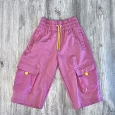 New With Tags. Never Worn. Nike Athleisure Pants For Summer, Nike Summer Athleisure Pants, Nike Pink Bottoms With Pockets, Pink Nike Bottoms With Pockets, Nike Casual Pink Bottoms, Nike Bottoms With Pockets Short Length, Casual Pink Pants With Built-in Shorts, Purple Streetwear Shorts For Spring, Purple Shorts For Spring Streetwear