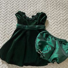 Absolutely Beautiful And Never Worn! Emerald Green Bonnie Baby Velvet Dress With Matching Diaper Cover, Size 24 Months. This Dress Was Never Worn! Five Rosettes Grace The Collar While The Back Closes With Dainty Buttons And Satin-Like Ribbon. From A Smoke Free, Pet Free Home. No Rips, Tears Or Stains. Perfect For The Upcoming Holidays! Emerald Green Baby Dress, Baby Velvet Dress, Emerald Green Velvet Dress, Emerald Green Velvet, Baby Green, Green Velvet Dress, Green Baby, Diaper Cover, Cover Size