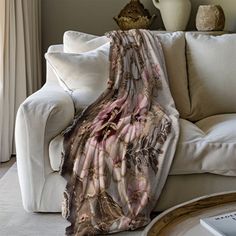 a blanket draped over a couch in a living room