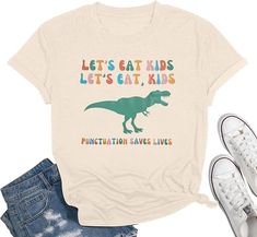 PRICES MAY VARY. Preschool Teacher Shirt: Cotton blend, soft, wrinkle free, breathable and stretchy fabric, comfy to your touch Funny Dinasour Shirt Ladies: This funny "Lets Eat Kids, punctuation saves lives" letter printed and dinasour graphic shirt is very cute and beautiful, lightweight, classic fit Dino T Rex Tee: Punctuation teacher shirts will be the nice match with you, this women stretch top suitable for casual, daily wear, outdoor activities, vacation any other special occasion Kinderga Teacher Tee Shirts, Kindergarten Teacher Gifts, Preschool Teacher Shirts, English Teacher Gifts, Dino Shirt, Kindergarten Gifts, Kindergarten Teacher Shirts, Teachers Gifts, Letters For Kids