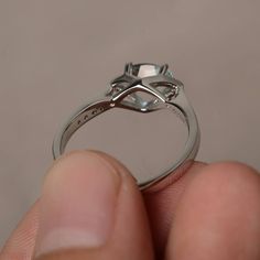 This is a gorgeous handmade creation. Its beauty is its simplicity & Elegance. The 5*7 mm oval shape faceted natural aquamarine is crafted in solid sterling silver and with rhodium plated. All item is sent in a beautiful gift box If you have any idea of design your ring,pls contact me directly. You can realize more lovely stuff clicking the link https://www.etsy.com/shop/knightjewelry?refshopsection_shophome_leftnav Please leave the correct address and you phone number for delivering success Oval Aquamarine Diamond Ring With Prong Setting, Oval Aquamarine Diamond Ring In White Gold, Oval Blue Topaz Diamond Ring With Brilliant Cut, Oval Aquamarine Diamond Ring Gift, Oval Aquamarine Diamond Ring As Gift, Oval Aquamarine Promise Ring, Silver Oval Aquamarine Birthstone Ring, Silver Aquamarine Oval Birthstone Ring, Silver Aquamarine Birthstone Ring, Oval Shape