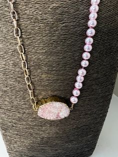 It's a Druzy pink and all Pink pearls 8mm in size will  bring out the center focal druzy. This necklace is 24 inches in length and has an interlocking clasp. What allows the pearls to flow with grace is that they are knotted. Adjustable Pink Pearl Chain Necklace, Elegant Pink Beaded Necklaces With 8mm Beads, Elegant Pink Beaded Necklace With 8mm Beads, Elegant Pink Necklaces With 8mm Beads, Pink Pearl Charm Necklace For Parties, Pink Pearl Jewelry With 8mm Beads, Adjustable Pink Necklace With Pearl Pendant, Pink Pearl Drop Necklace For Party, Pink Pearl Necklace With Natural Round Beads