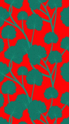 a red background with green leaves on it