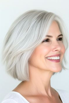 Layered Blunt Bob Haircut on a smiling woman in her 50s with light silver hair, side view. Gray Hairstyles, Grey Hair Over 50, Layered Haircuts For Women, Layered Bob Haircuts, Classic Bob, Layered Bob Hairstyles, Short Grey Hair, Short Layered Haircuts